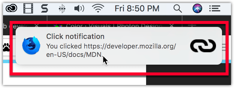 在 macOS 上的示例通知:通知位于系统时钟下方,有一个粗体标题“Click notification”,接着是一段正常字体的文本“You clicked https://big.rakal.top/en-US/docs/MDN”。通知的左侧有 Firefox Nightly 的标志,右侧有一个链接图标。